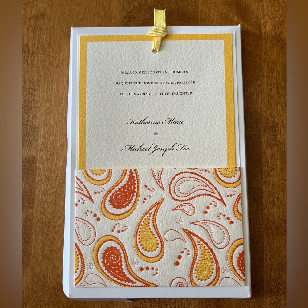 BRIDES  Invitation / response kit. Cream card w/orange border & paisley sleeve